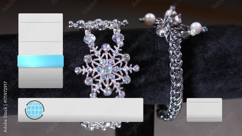 A fictional, QVC-like home shopping television content screen. Slowly rotating silver jewelry items with blank graphical boxes along the sides for your custom text.  	
