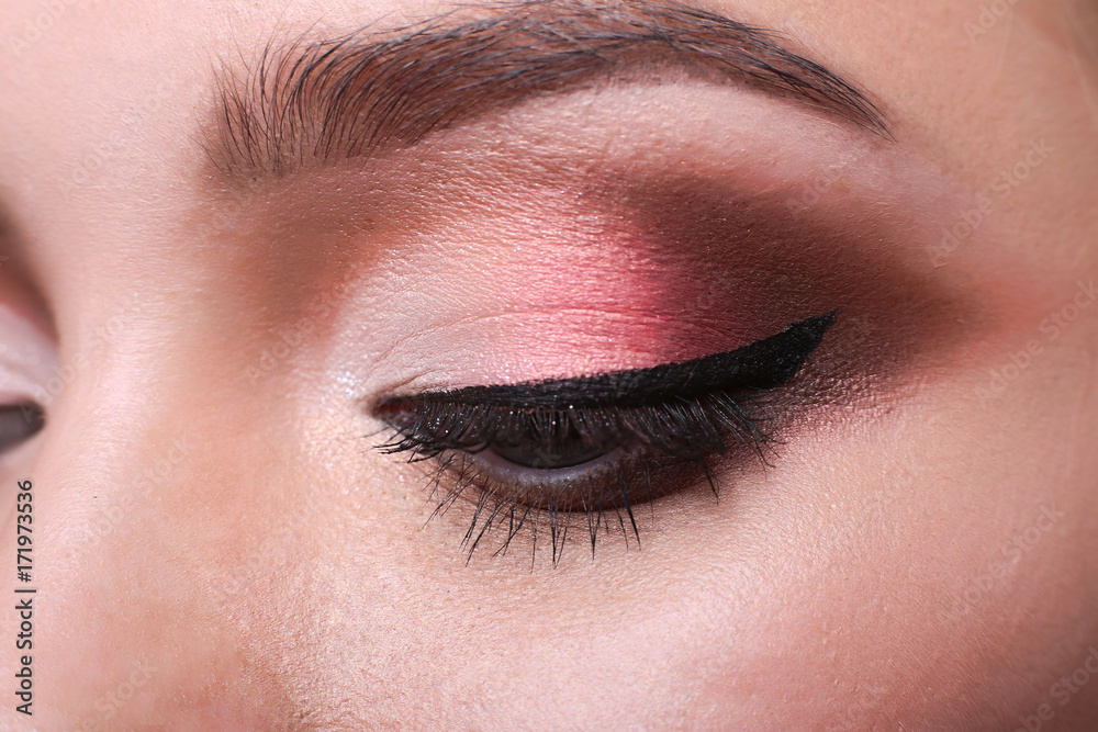 Naklejka premium Eye with bright makeup closeup, model face crop