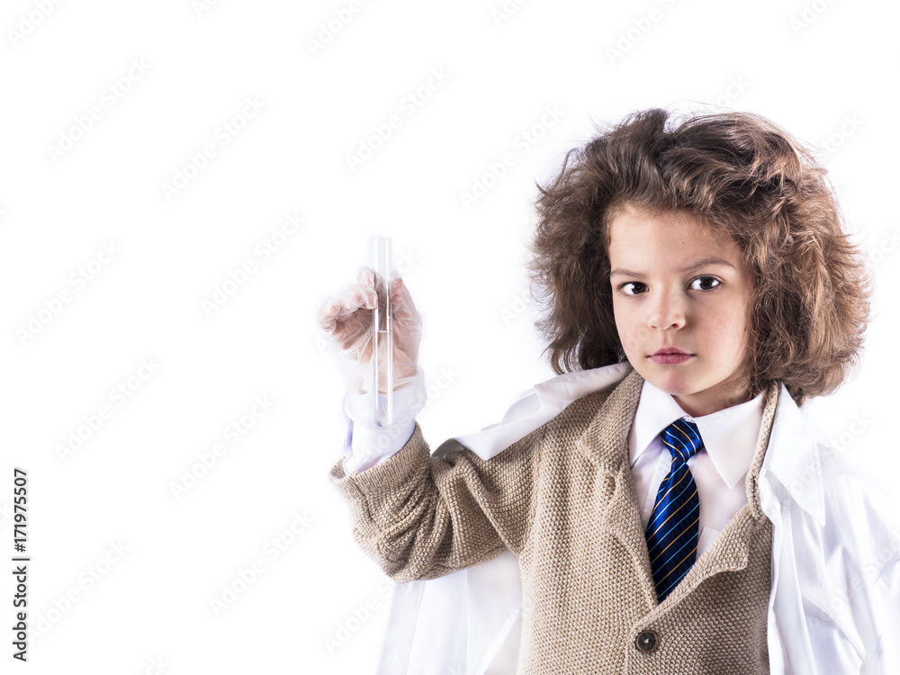 A ilittle curly-haired boy in a medical gown holds a test tube with one hand . White background. A ilittle curly-haired boy in a medical gown holds a test tube with one hand . White background.
