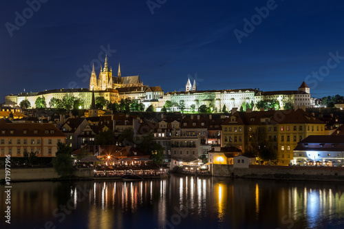 View of the lit Prague (Hradcany) Castle and other buildings at the Mala Strana (Lesser Town) district in Prague, Czech Republic, at night.
