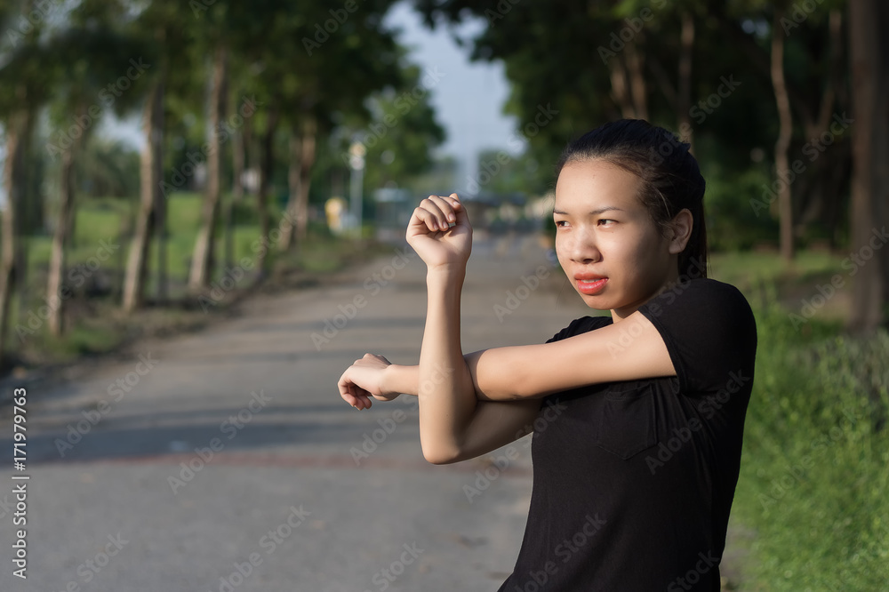 Asian women exercise at the park in the morning. Asian women exercise at the park in the morning.