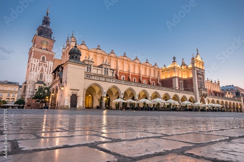 Cloth Hall and Town Hall tower on the Main Market Square in Krakow, illuminated in the morning