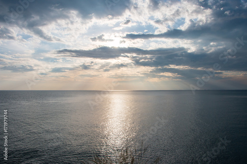 Sunset in the sea and blue sky background.