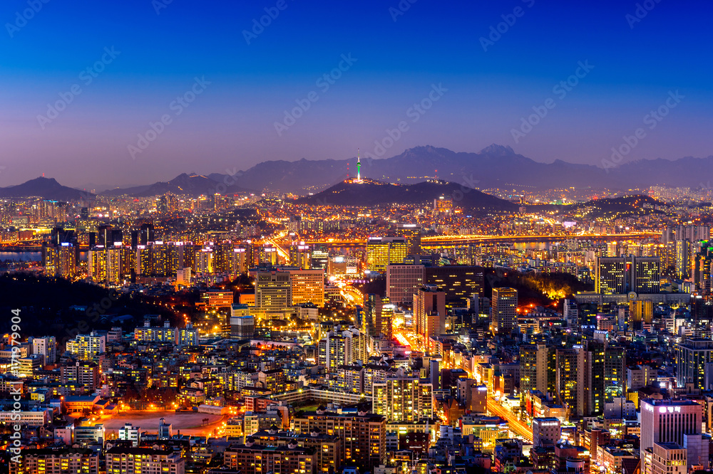 Seoul cityscape and Seoul tower at night. Traffic in Seoul, South Korea.