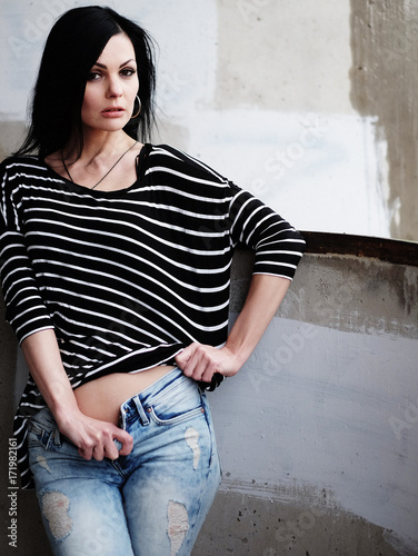 Beautiful young woman in a striped T-shirt © Raisa Kanareva
