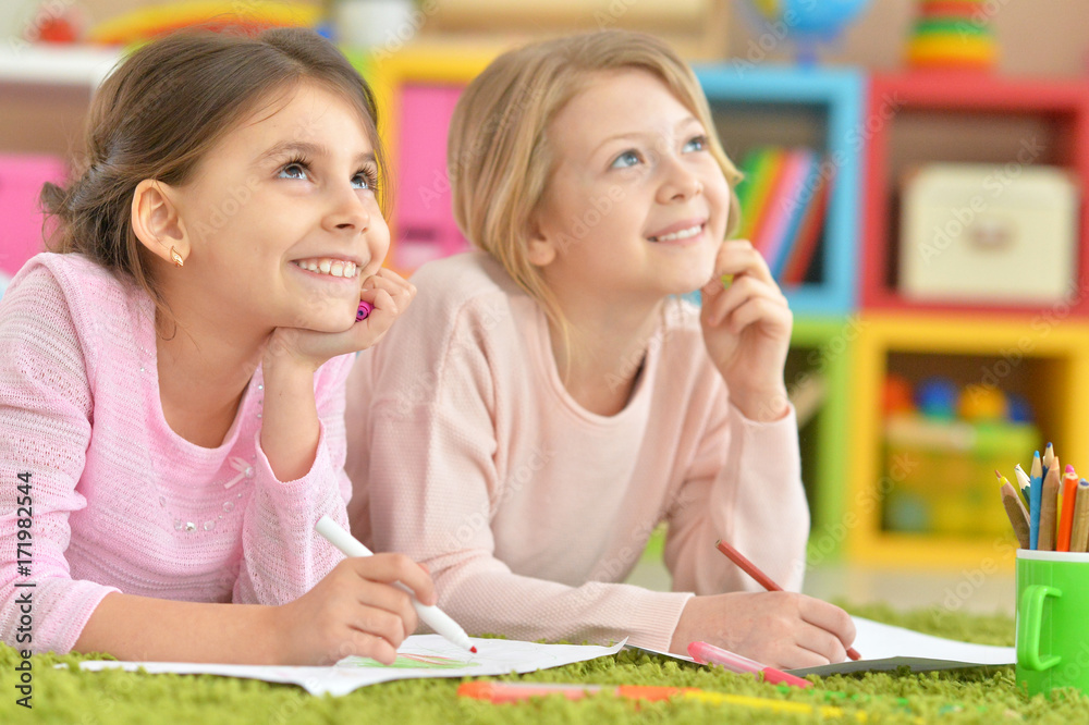little girls drawing together little girls drawing together