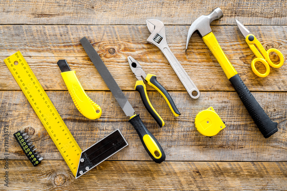 building, painting and repair tools for house constructor work place set wooden background top view building, painting and repair tools for house constructor work place set wooden background top view