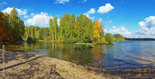 Fototapeta Naklejka Na Ścianę i Meble -  Autumn landscape colorful deciduous forests on the banks of rivers, lakes.