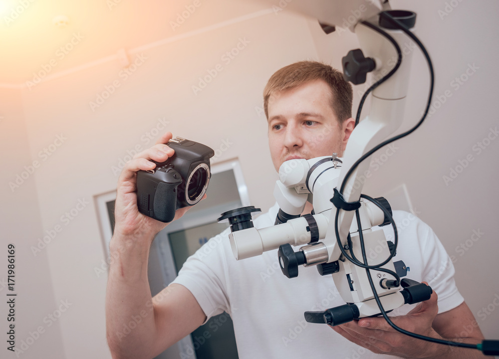 Microscope with photo camera in the dental office Microscope with photo camera in the dental office