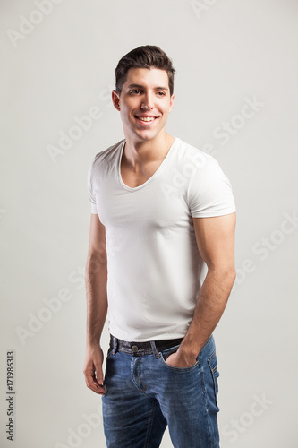 studio shot of young man in jeans and t-shirt