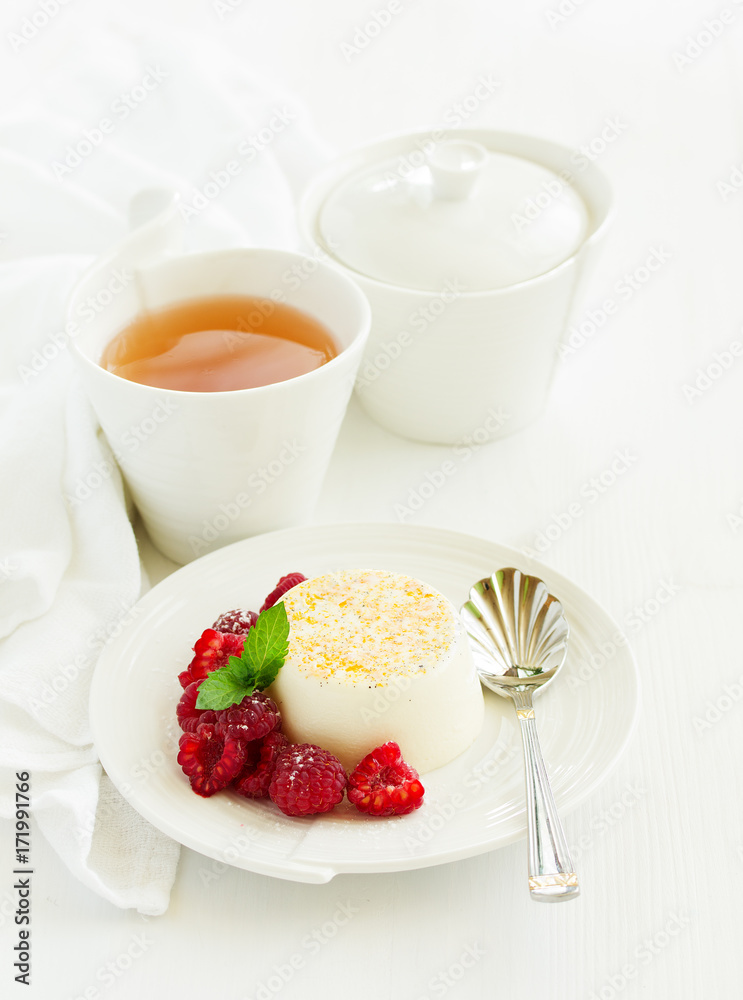 Delicious home-made dessert Panna cotta. Cream-caramel, caramel custard, with raspberries. Delicious home-made dessert Panna cotta. Cream-caramel, caramel custard, with raspberries.