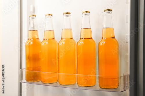 Bottles of lemonade in fridge