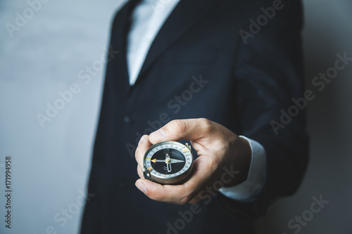 Compass on man hand