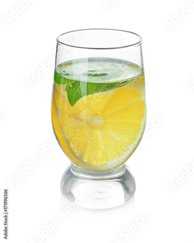 Basil water with lemon in glass, isolated on white