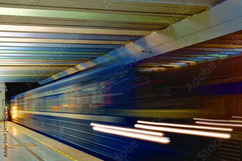 Background of motion blur of speed train in the subway. Underground vehicle dynamic motion.
