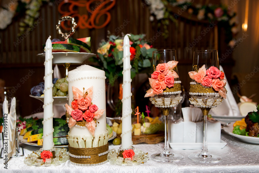 champagne glasses with candles ready for a celebration