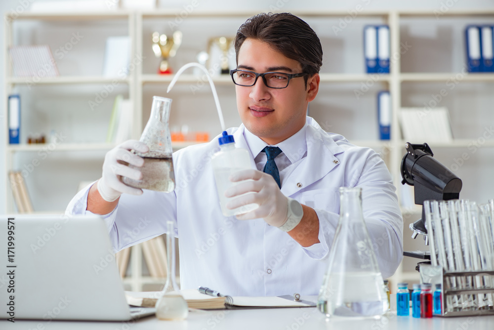 Young researcher scientist doing a water test contamination expe Young researcher scientist doing a water test contamination expe