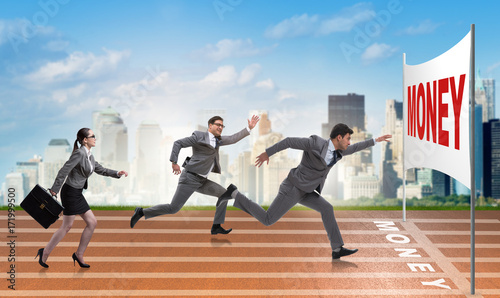 Business people running towards money goal