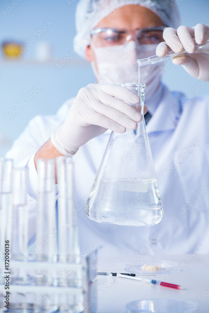 Female scientist researcher conducting an experiment in a labora Female scientist researcher conducting an experiment in a labora