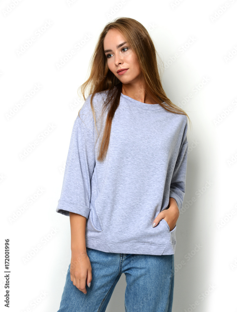 woman posing in new fashion blue jeans and pullover with text copy space woman posing in new fashion blue jeans and pullover with text copy space