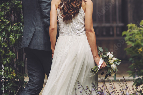 bridal couple, sensual bride and happy groom together