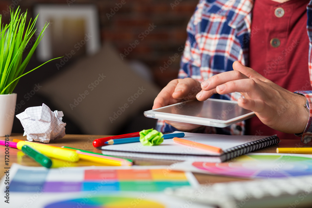Young perspective designer with graphic tablet in modern office Young perspective designer with graphic tablet in modern office