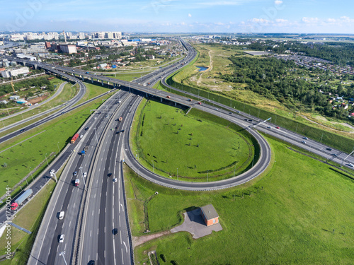 Multi-lane highway exits. Interganges of Saint Petersburg ringroad at summer. Top view. St. Petersburg, Russia