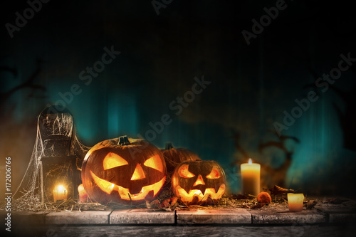 Halloween pumpkins on wooden planks.