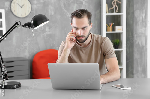 Young man searching informa...