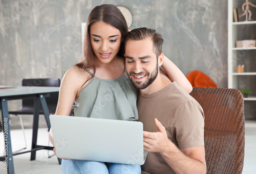 Young couple searching info...