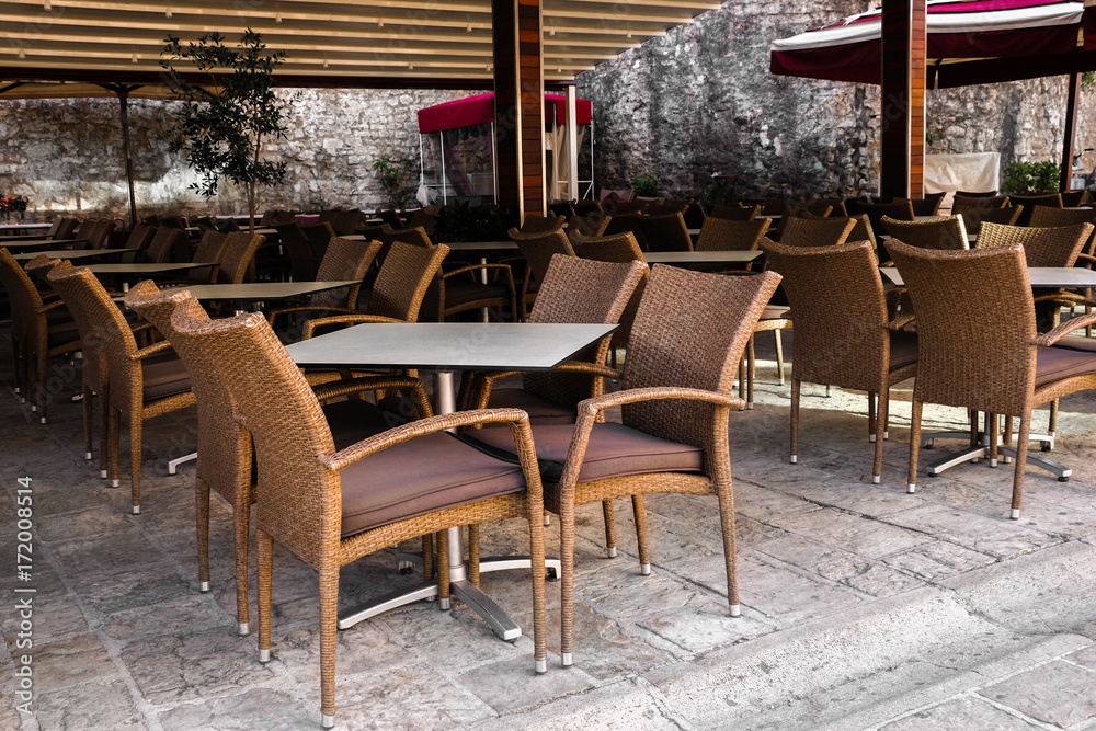 Chairs and tables in modern cafe outdoors