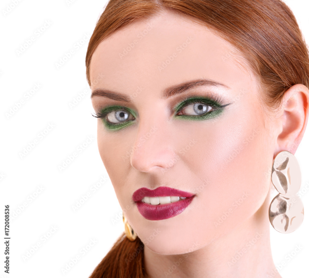 Beautiful redhead woman with bright green makeup, isolated on white Beautiful redhead woman with bright green makeup, isolated on white