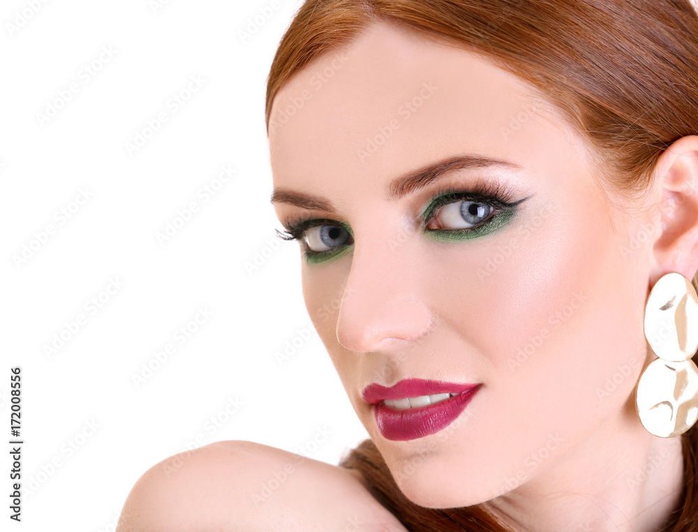 Beautiful redhead woman with bright green makeup, isolated on white Beautiful redhead woman with bright green makeup, isolated on white