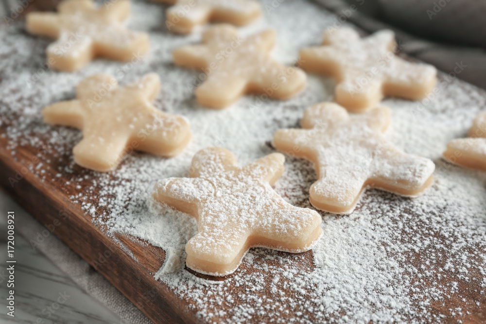 Christmas raw cookies on wooden board