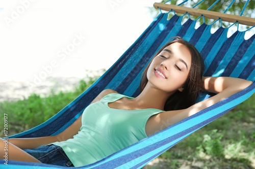 Young woman relaxing in ham...
