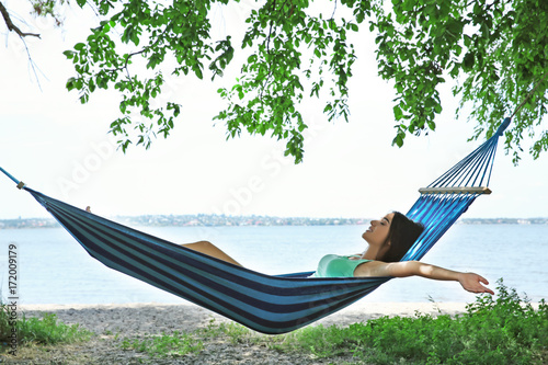 Young woman relaxing in ham...