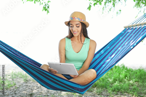 Young woman with tablet in ...