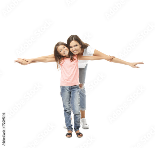 Cute little girl with mother on white background