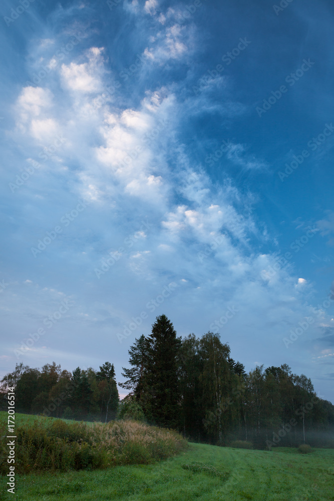 Sunrise summer morning at countryside field in Finland Sunrise summer morning at countryside field in Finland