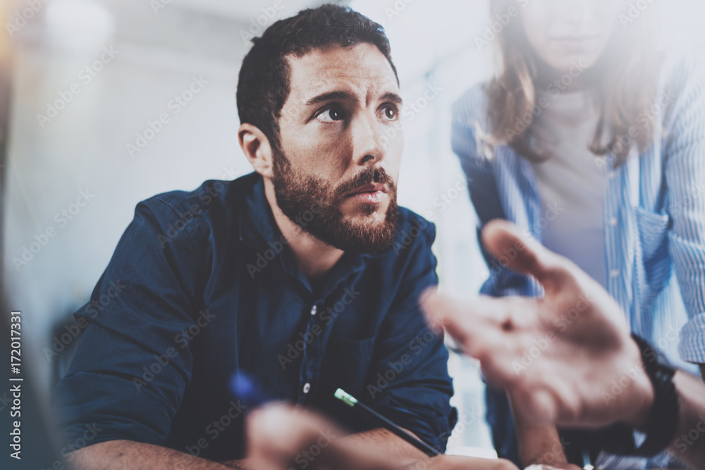 Account manager working process.Young coworkers work with new startup project in office.Horizontal.Blurred background. Account manager working process.Young coworkers work with new startup project in office.Horizontal.Blurred background.