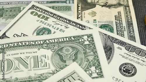 Golden and silver bitcoin coins and american dollars notes on abstract background. Bitcoin cryptocurrency.