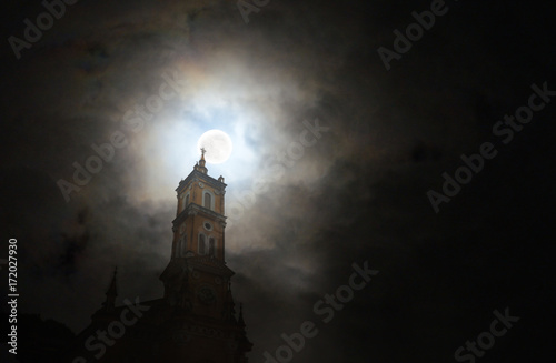 Canvas Print Church in the dark under the full moon.