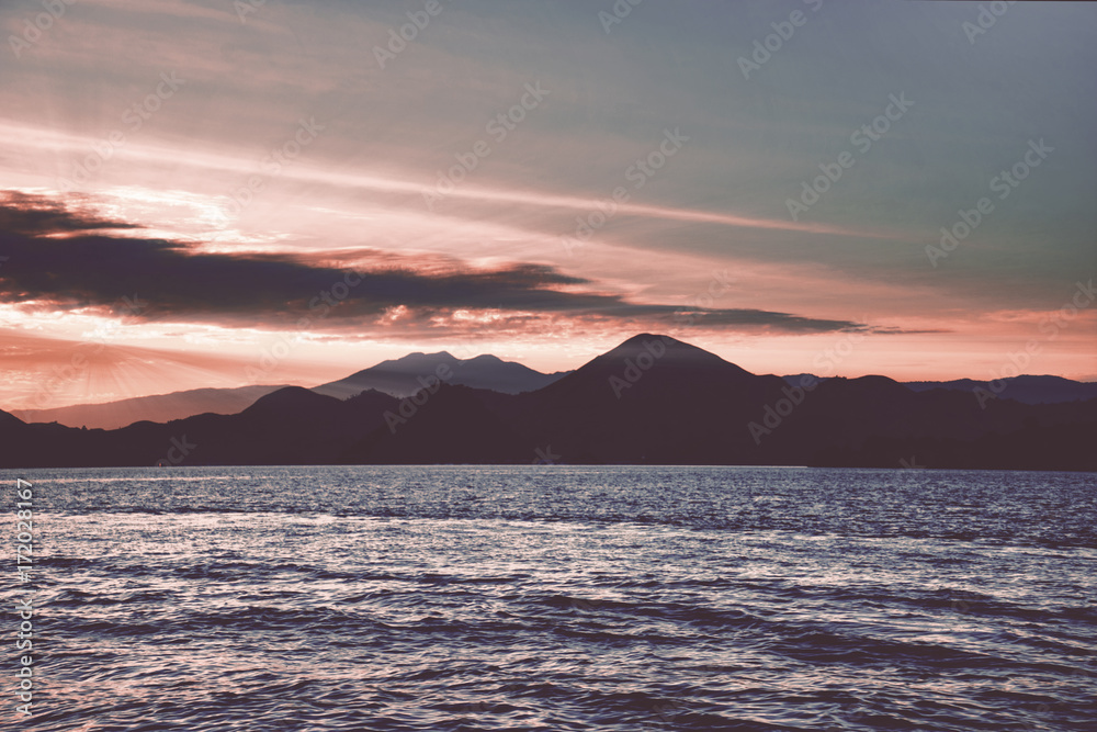 Beautiful Padar island under orange clouds