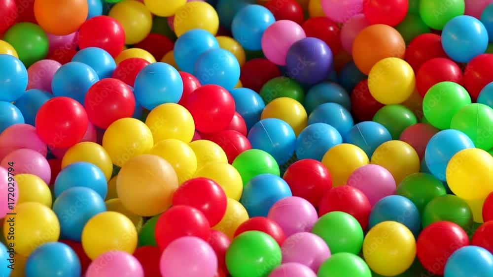 Children's playground with colorful plastic balls in pool. Multicolored balls for children's fun. Background. Children's playground with colorful plastic balls in pool. Multicolored balls for children's fun. Background.