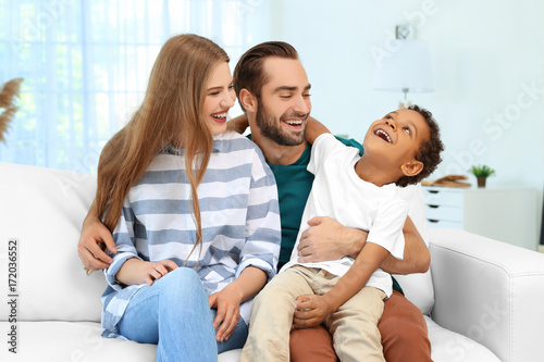 Happy couple with adopted A...