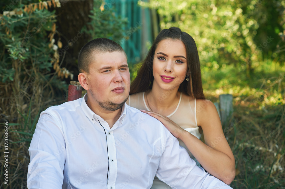 Beautiful wedding couple in a Park. Wedding day of a young couple . Portrait of the bride and groom close-up