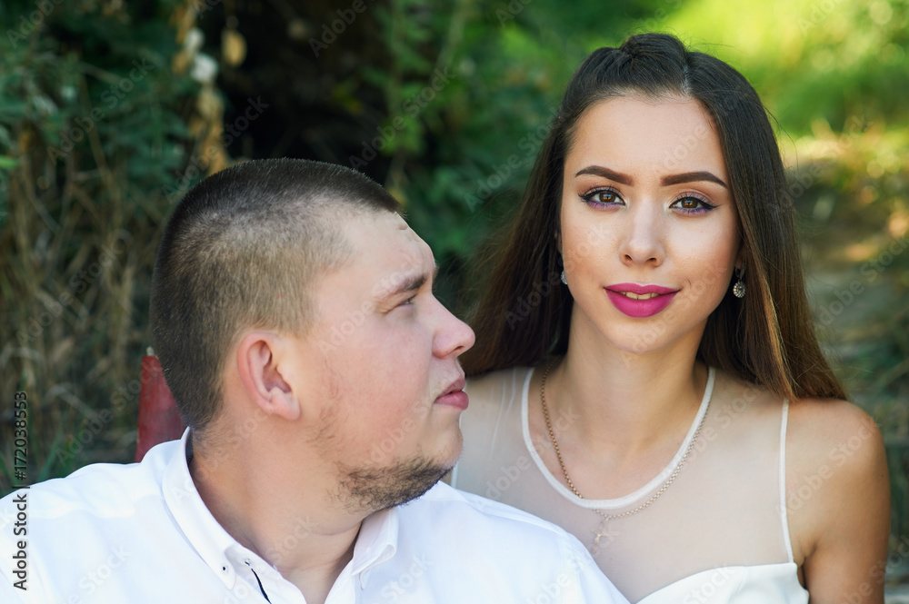 Beautiful wedding couple in a Park. Wedding day of a young couple . Portrait of the bride and groom close-up Beautiful wedding couple in a Park. Wedding day of a young couple . Portrait of the bride and groom close-up