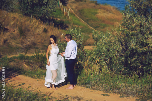 Young romantic couple during the wedding walk in nature. the bride and groom © fisher05