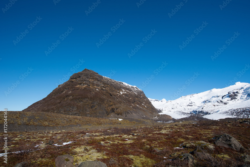 View of lava field ,black rocky lava covered by moss in Vatnajokull National Park, beautiful volcanic landscape of Iceland. View of lava field ,black rocky lava covered by moss in Vatnajokull National Park, beautiful volcanic landscape of Iceland.