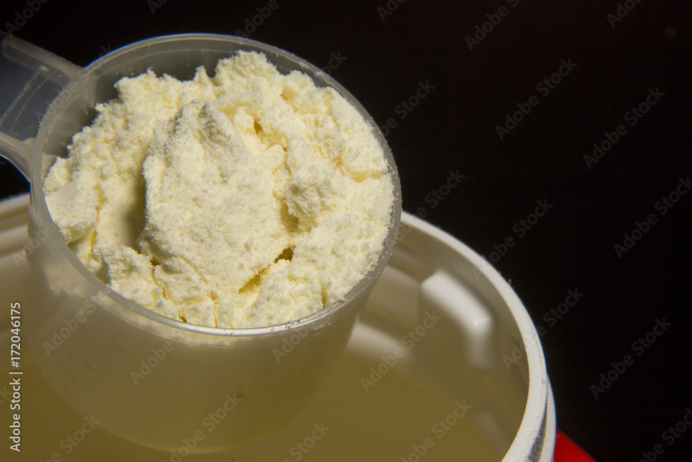 the whey protein powder closeup image black background the whey protein powder closeup image black background